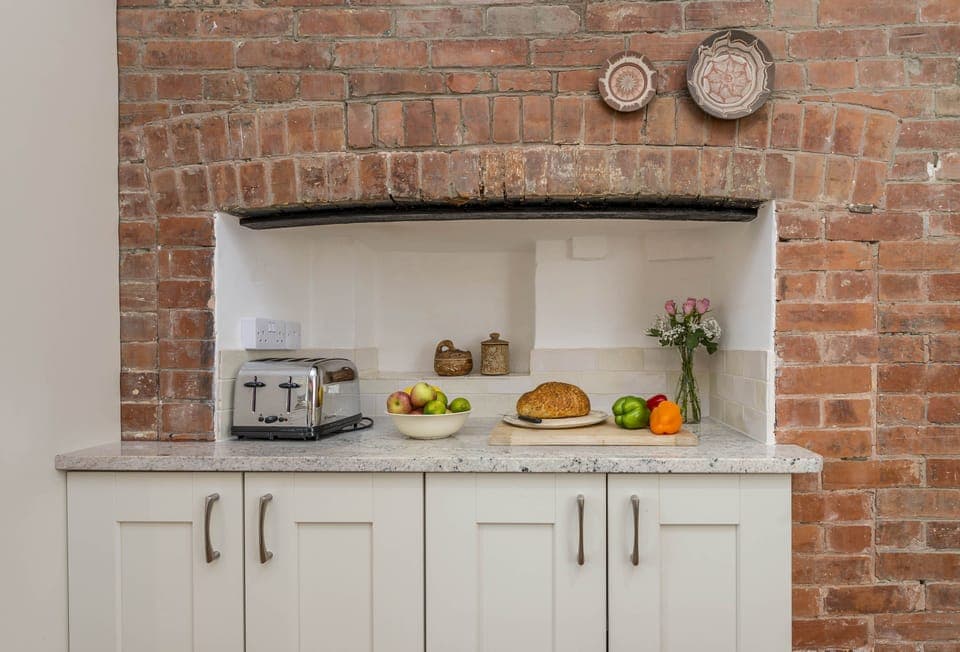 Ground floor: Exposed brickwork in this magnificent farmhouse kitchen