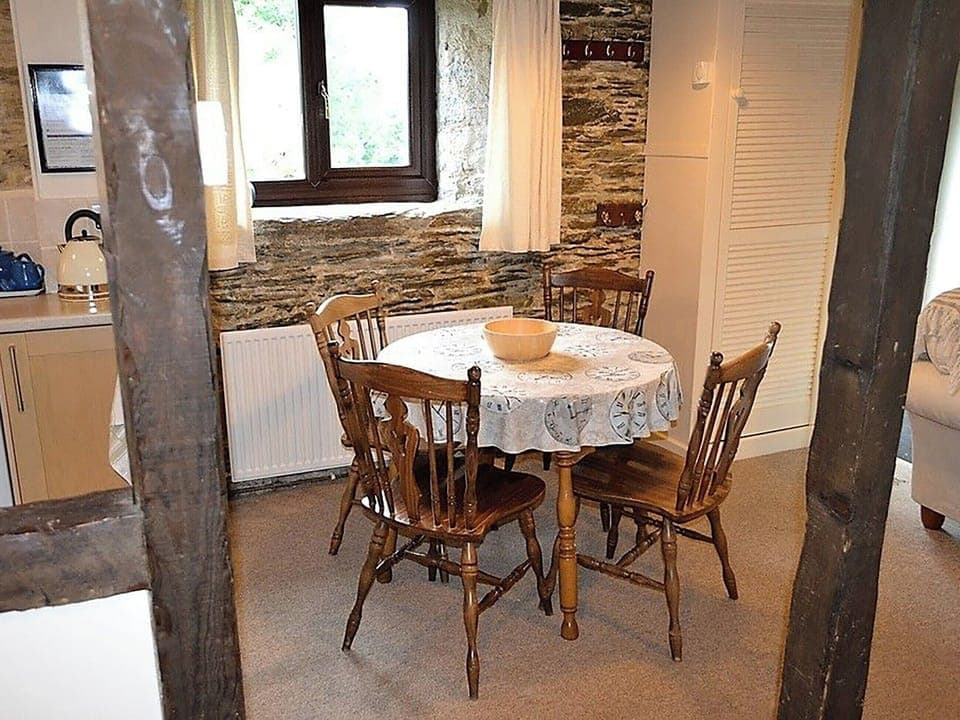 Dining area with seating for four people | Mill Cottage, Fowey