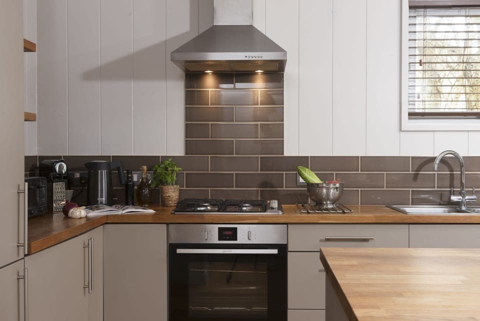 Modern kitchen, oven and hob, fridge/freezer, coffee machine, plenty of worktop space  - Blackbird Lodge