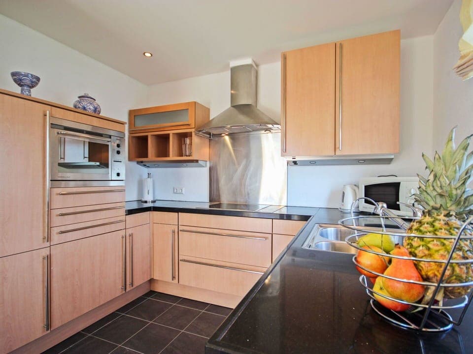 Countertop, Room, Cabinetry, Property, Kitchen, Furniture, Yellow, Building, Floor, Orange