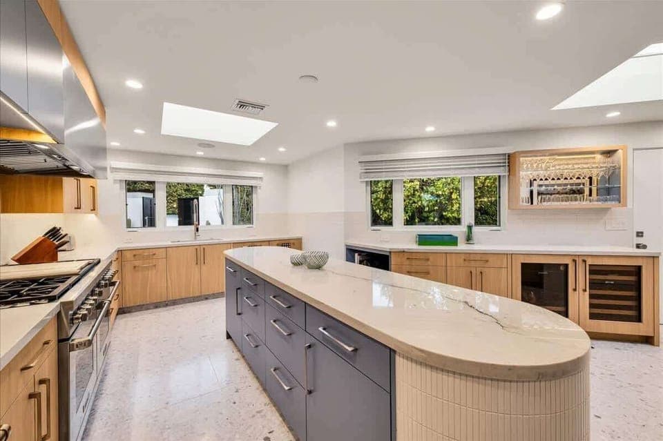 Elevate your culinary experience in this Chef’s kitchen, boasting a Wolf 6-burner cooktop, double oven, sleek French door Sub-Zero refrigerator, & sleek countertops, .Gather around the island seating for vibrant meals and creating delicious memories!