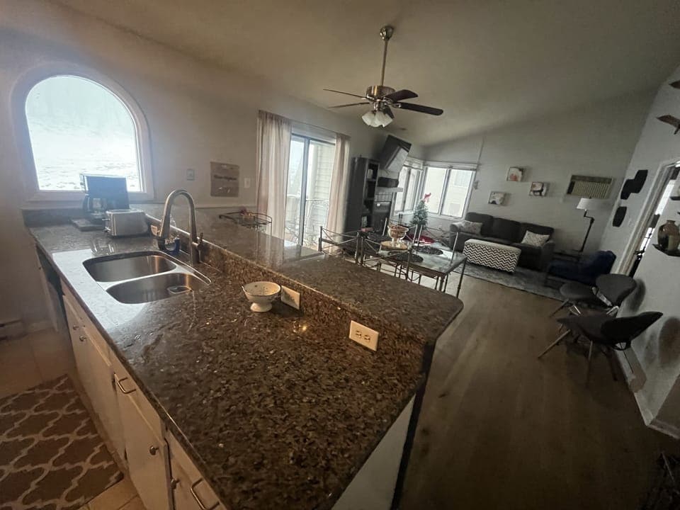 Open living area with kitchen and dining room. Perfect space for an escape!