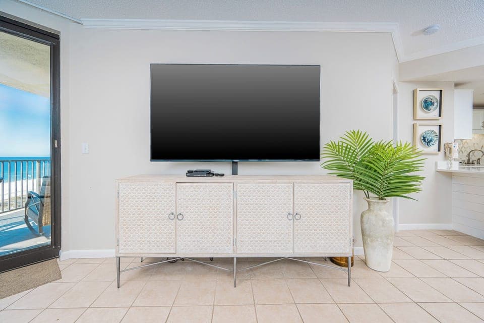 Enjoy the spacious living area with a large TV, stylish decor, and a view that enhances your relaxation experience