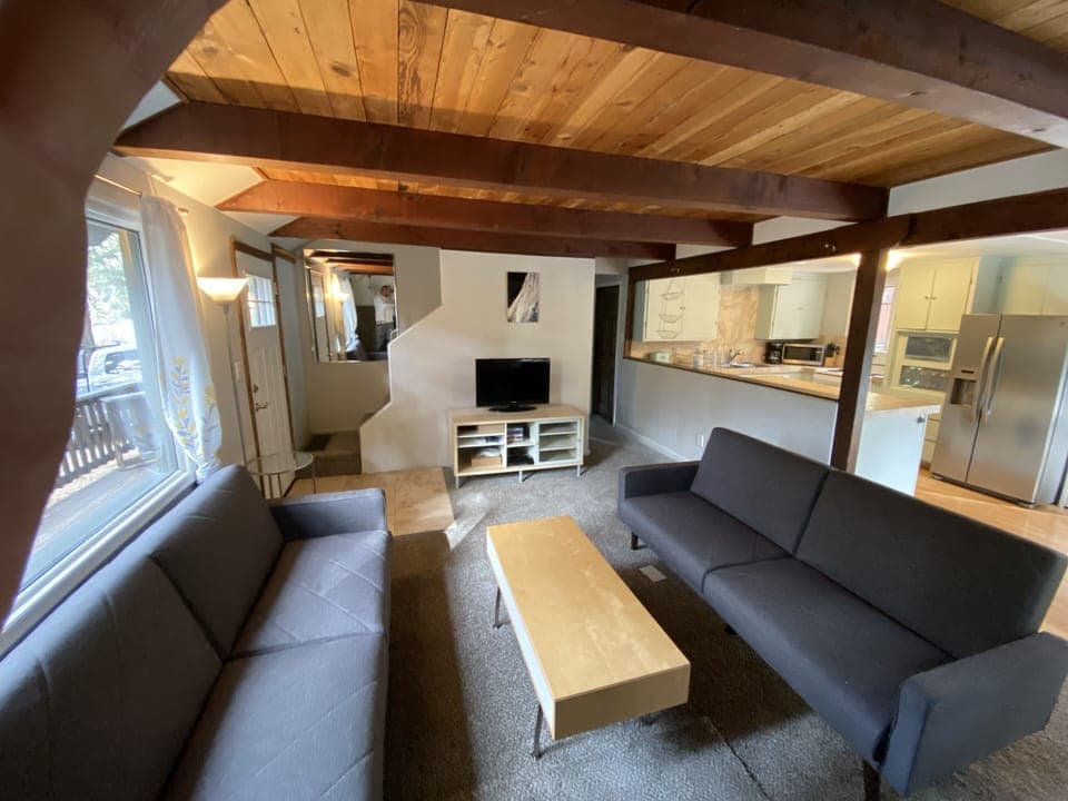 Living room with 2 couches they turn to beds. 