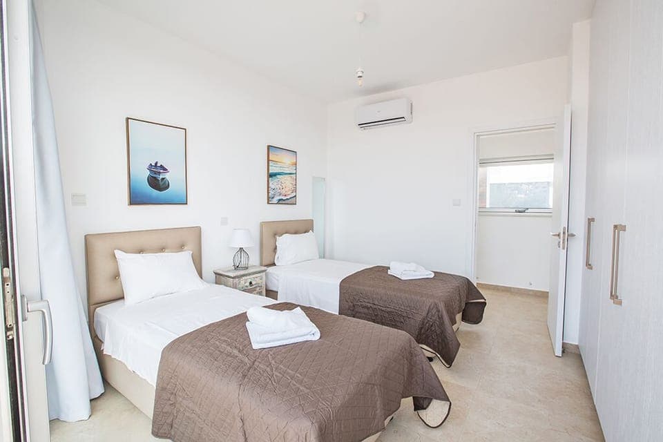 Bedroom 3 with two single beds and space for two extra beds