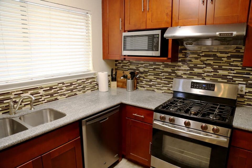 Kitchen includes appliances: Gas Stove, Dishwasher, Microwave Oven, Refrigerator