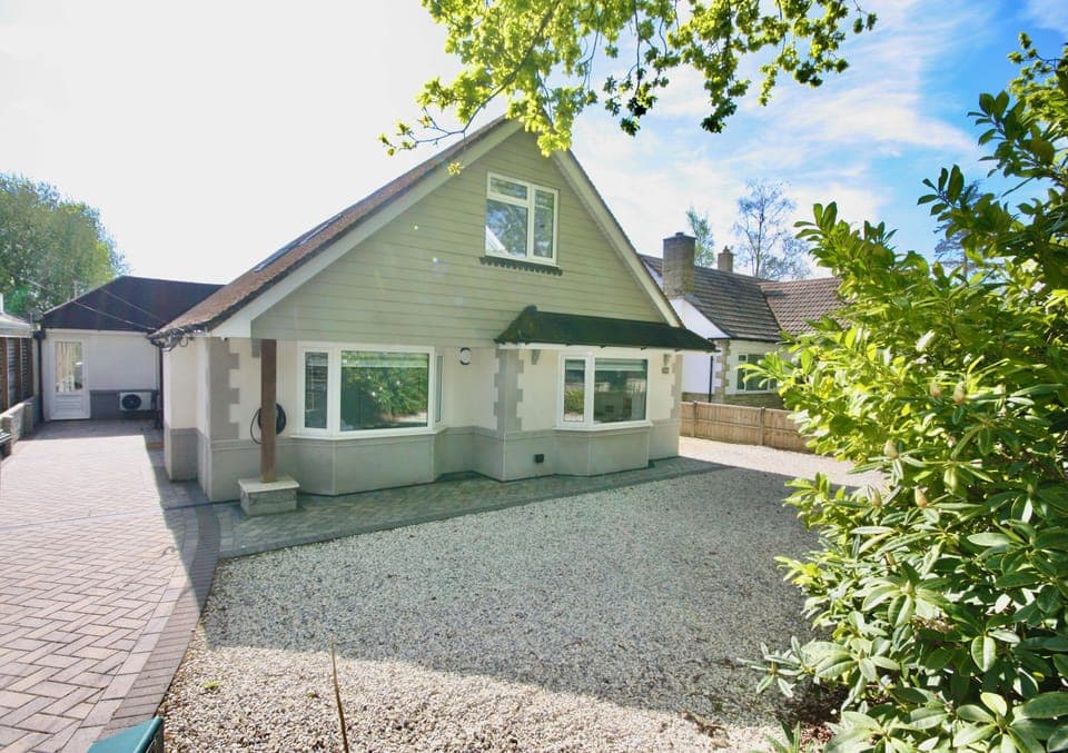 Main front of the property with plenty of parking spaces.. also a EV charger 