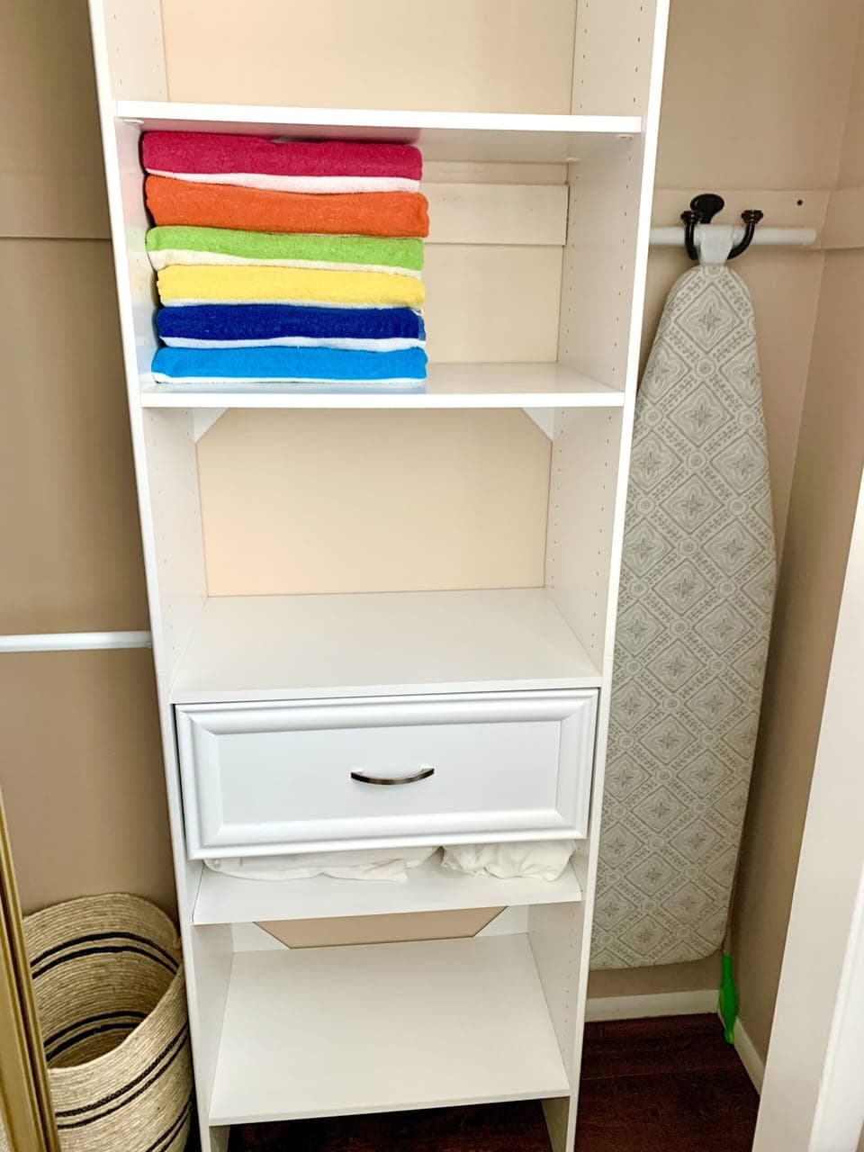 Pool towels, hamper, and ironing board