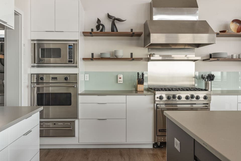Viking appliances; microwave, wall oven, & warming oven on left.