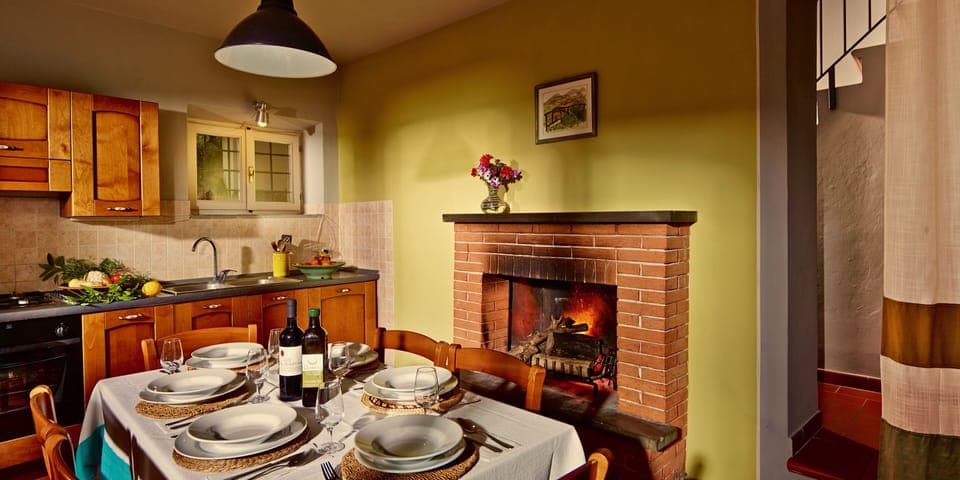  Big fully equipped family sized kitchen with fireplace for the colder months.