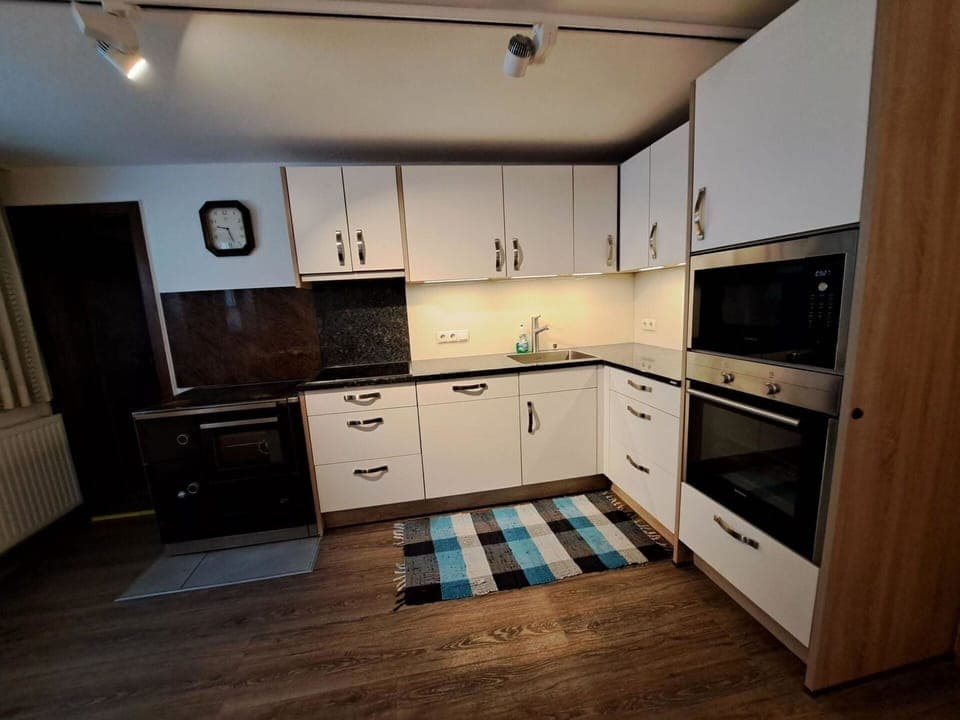 Cabinetry, Countertop, Drawer, Wood, Flooring, Kitchen, Floor, Interior Design, Home Appliance, Wood Stain