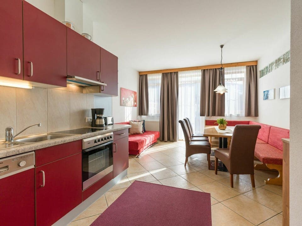 Cabinetry, Countertop, Kitchen Appliance, Wood, Orange, Lighting, Kitchen, Kitchen Stove, Interior Design, Flooring