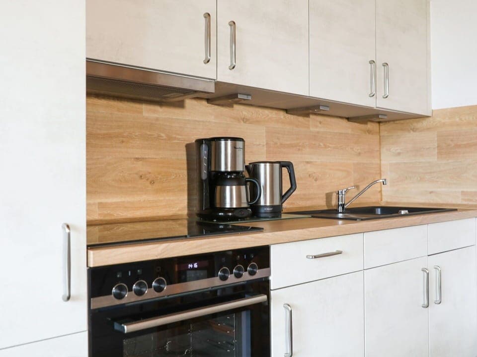 Cabinetry, Property, Countertop, Kitchen Sink, Kitchen Stove, Tap, Wood, Kitchen Appliance, Kitchen, Cooktop