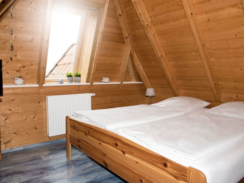 Bedroom, Room, Attic, Bed, Furniture, Bed Frame, Property, Wood, Wood Stain, Log Cabin