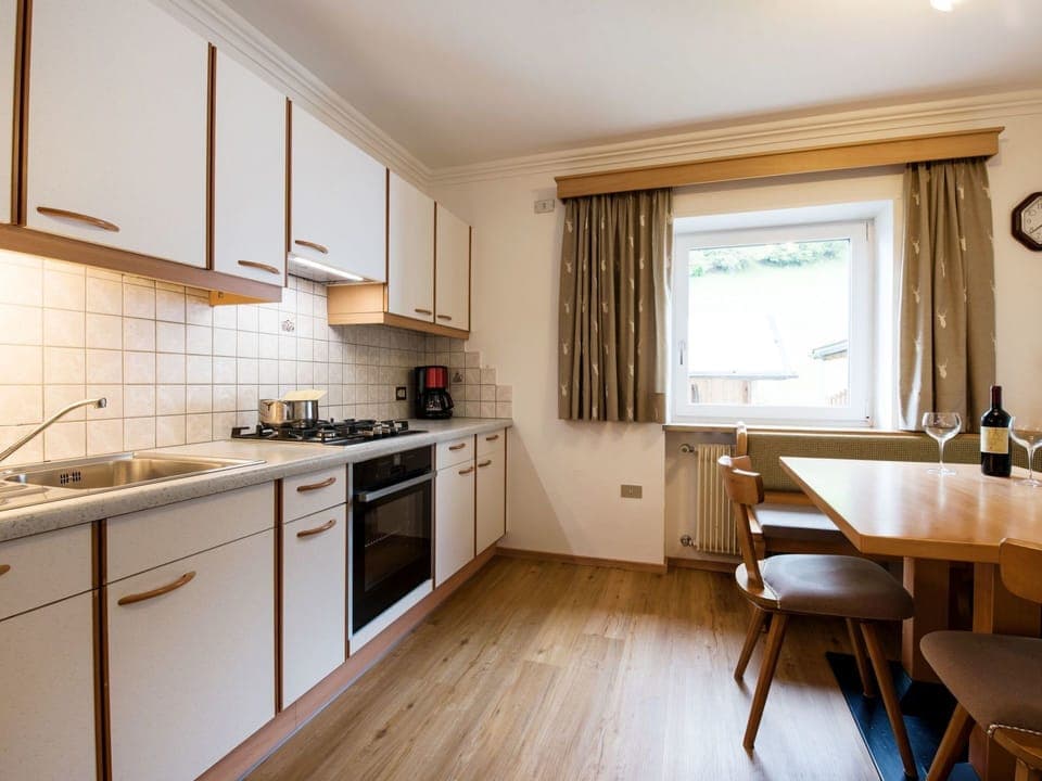 Room, Property, Furniture, Countertop, Kitchen, Cabinetry, Interior Design, Building, Floor, Yellow