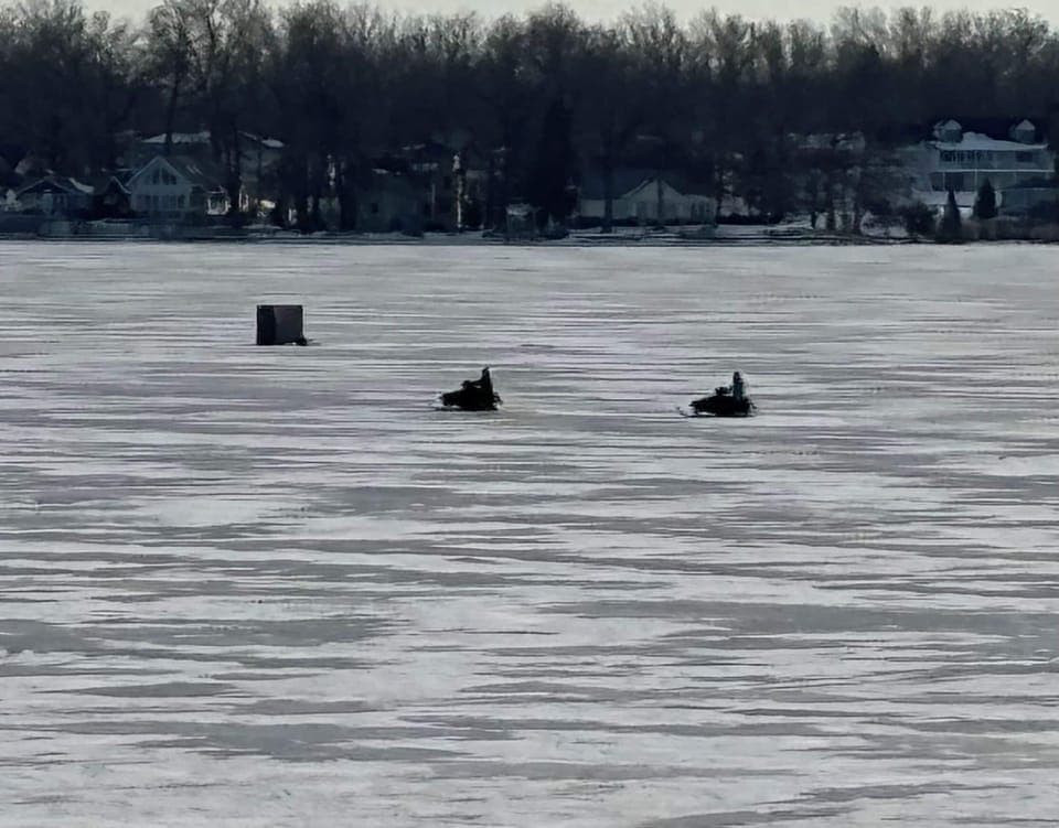 Ice fishing and snowmobiling! Always fun on the lake.