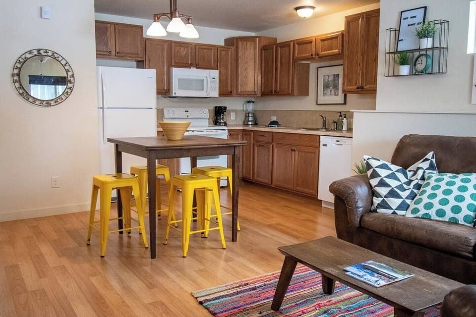 Table with seating for 4. Pulls out to accommodate more people. Extra seating in garage.