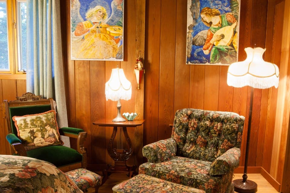 Quail Bedroom private sitting area and gorgeous forest views on three sides.