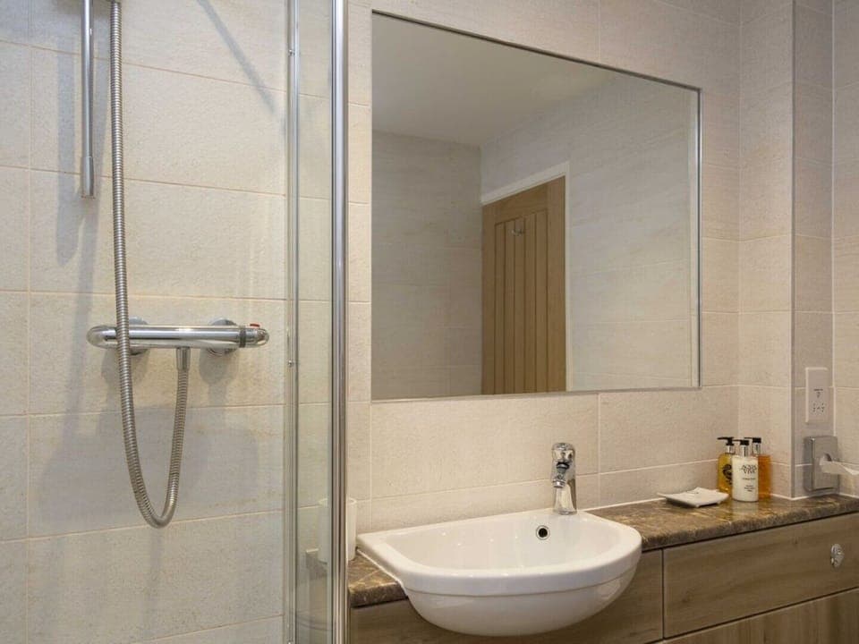 The Linhay Shower/bathroom with underfloor heating & Shower over bath.