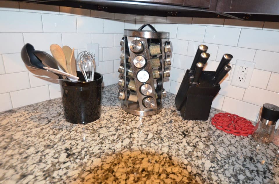 SPICE RACK:  fully stocked and cutlery, spoons, whisks.