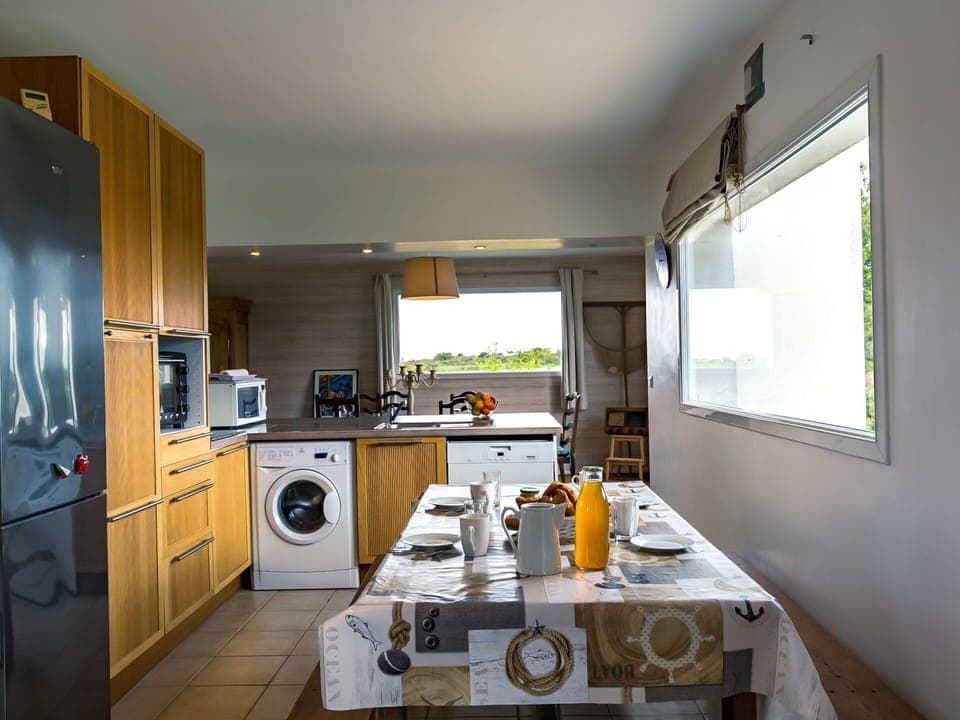 Property, Cabinetry, Countertop, Kitchen Appliance, Window, Home Appliance, Kitchen Stove, Kitchen, Table, Interior Design