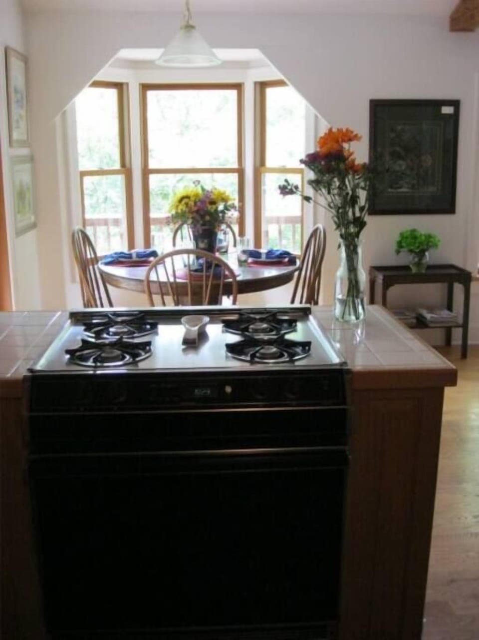 view from kitchen of dining area. open to living room