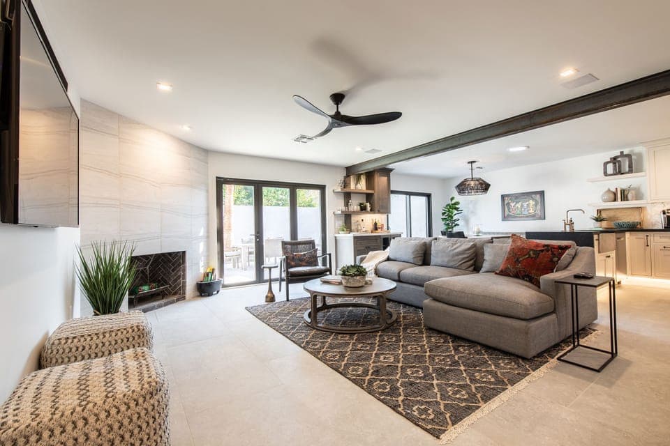 Walking from front door into the living room.  Notice the large 2'x4' tiles