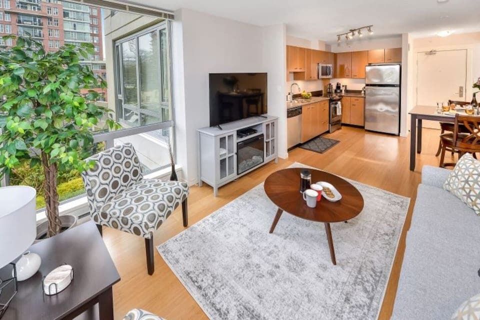 Bright living room with seating for 4.