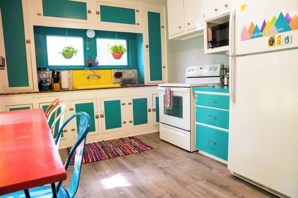 Bright cheerful kitchen with coffee maker, cookware, & all you need to feel home