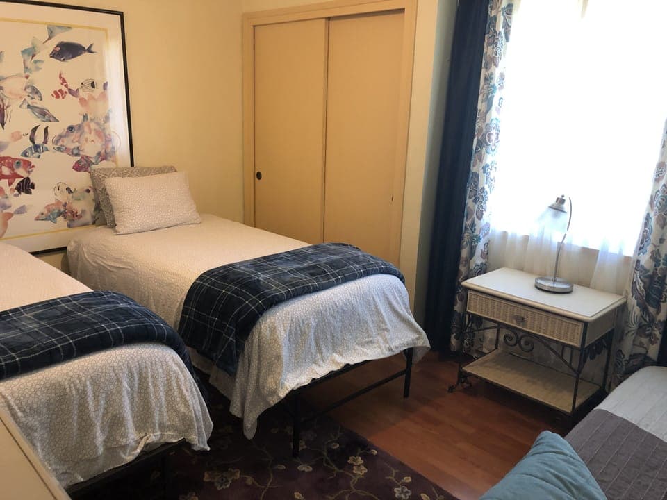 3rd bedroom with 3 beds and closet & dresser