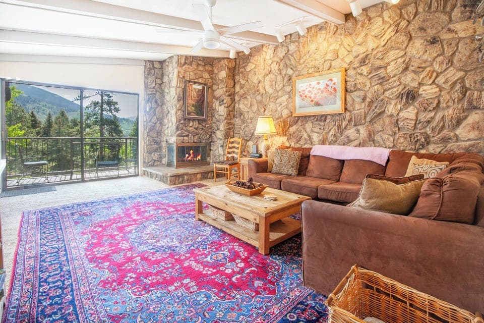 Living Room with Vaulted Ceiling and Balcony