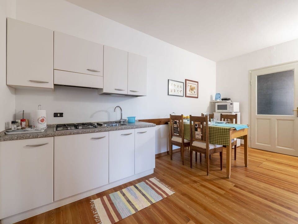 Cabinetry, Countertop, Kitchen, Kitchen Appliance, Wood, Kitchen Stove, Sink, Flooring, Floor, Window