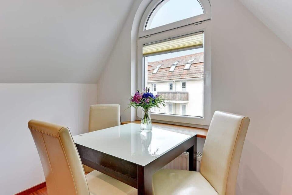 Large table with chairs for eating communal meals. 
