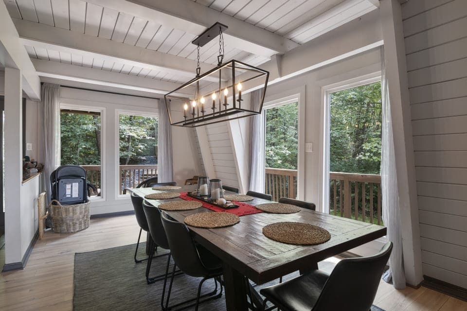 Dining area seats up to 10. Sidebar has plenty of glasses and dishes.