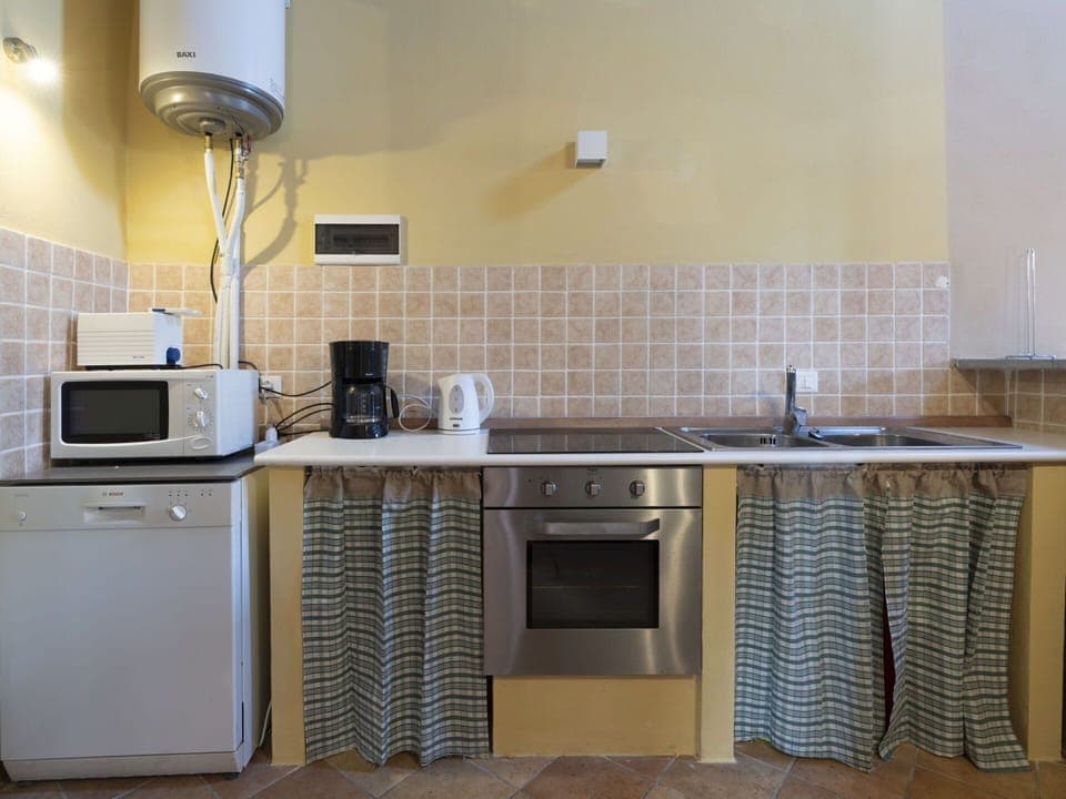 Cabinetry, Property, Countertop, Sink, Kitchen Sink, Kitchen Stove, Tap, Plumbing Fixture, Kitchen, Lighting