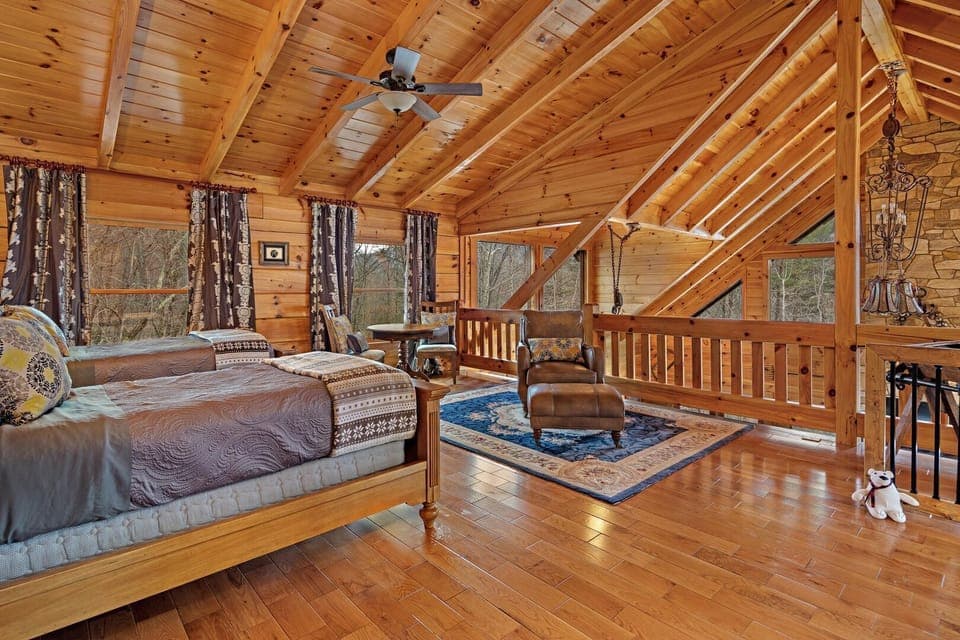 Upstairs loft with 2 twin beds and sitting area.