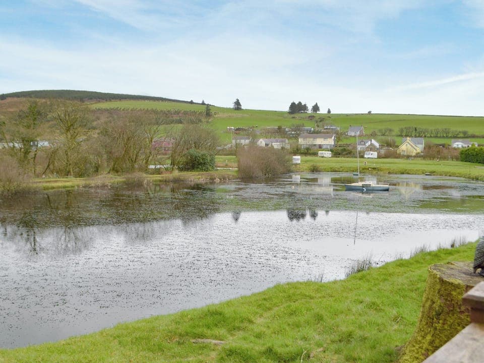 Relaxing views over the lake | Herons Log Cabin, Rosebush