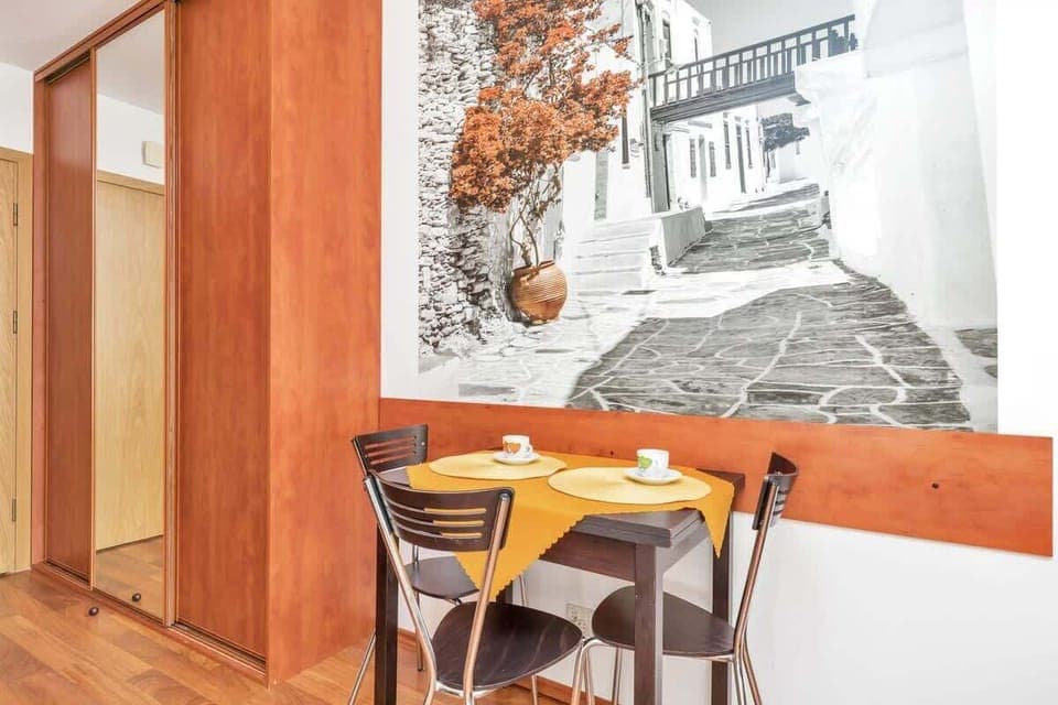 Enjoy a morning coffee from the coffee machine, while seating at the table with three chairs.