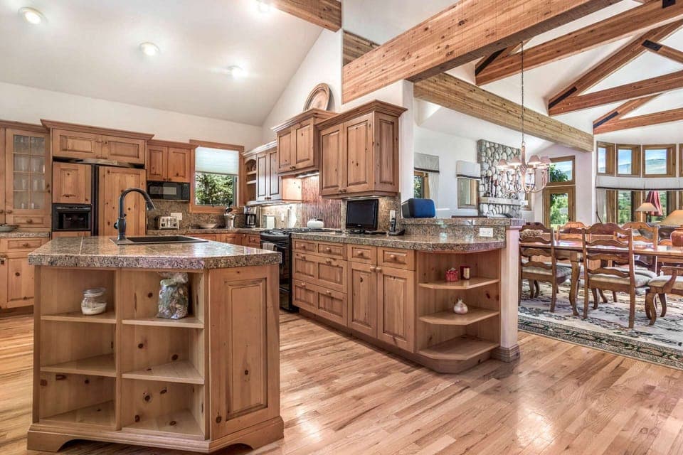 Steps away, the fully equipped kitchen features granite countertops.