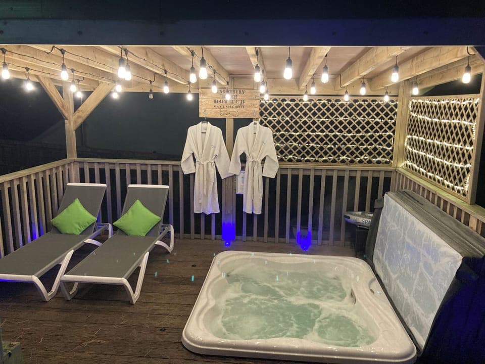 Feature lit covered Jacuzzi hot tub for guests exclusive use.