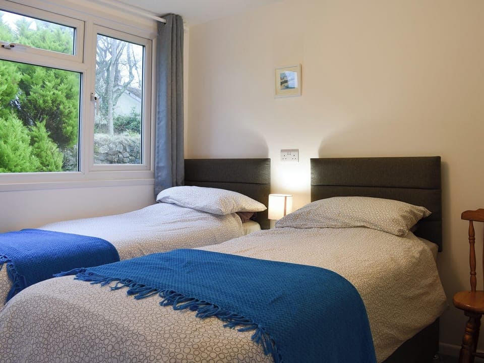 Inviting bedroom with twin single beds | Chalet 5 - Mount Hawke Holiday Bungalows, Mount Hawke, near Redruth