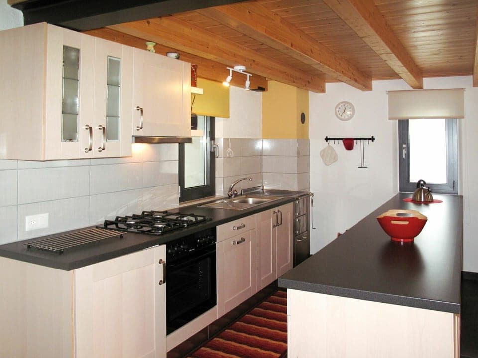 Countertop, Room, Kitchen, Property, Cabinetry, Furniture, Kitchen Stove, Building, Interior Design, Ceiling