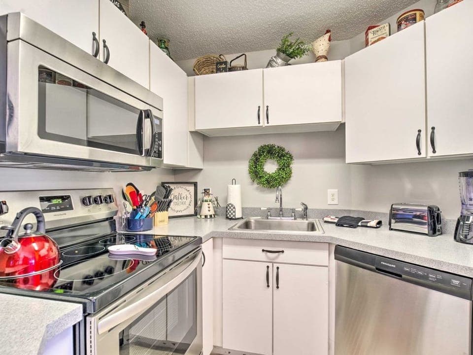 Kitchen with everything a cook needs — dual coffee makers, full cookware, new appliances