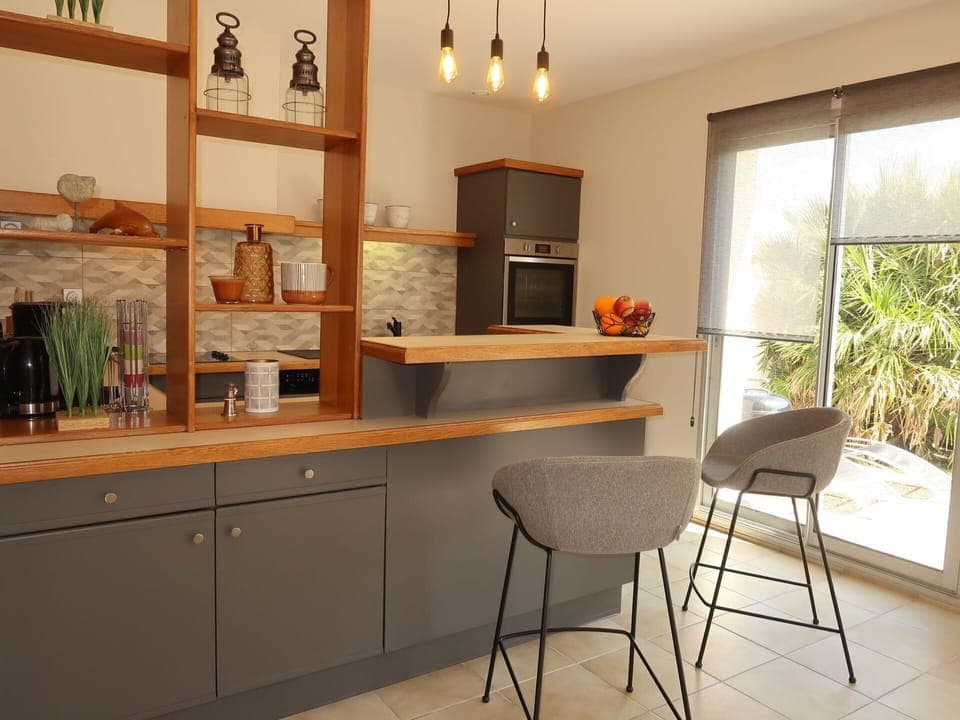 Cabinetry, Furniture, Countertop, Plant, Building, Wood, Kitchen, Lighting, Drawer, Chair