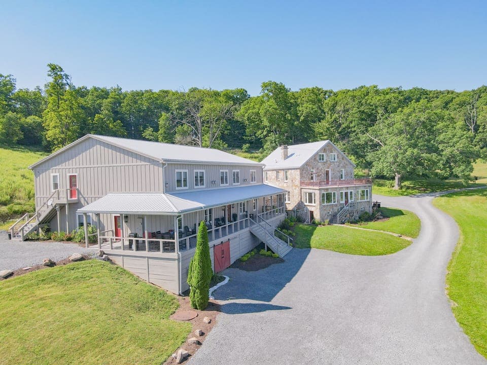 Inn is the larger building to the left. Stone House is a separate rental.