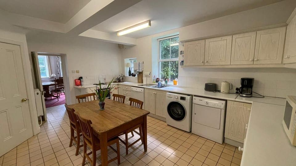 Kitchen with washer, dryer, dishwasher, microwave, coffee machine fridge freezer