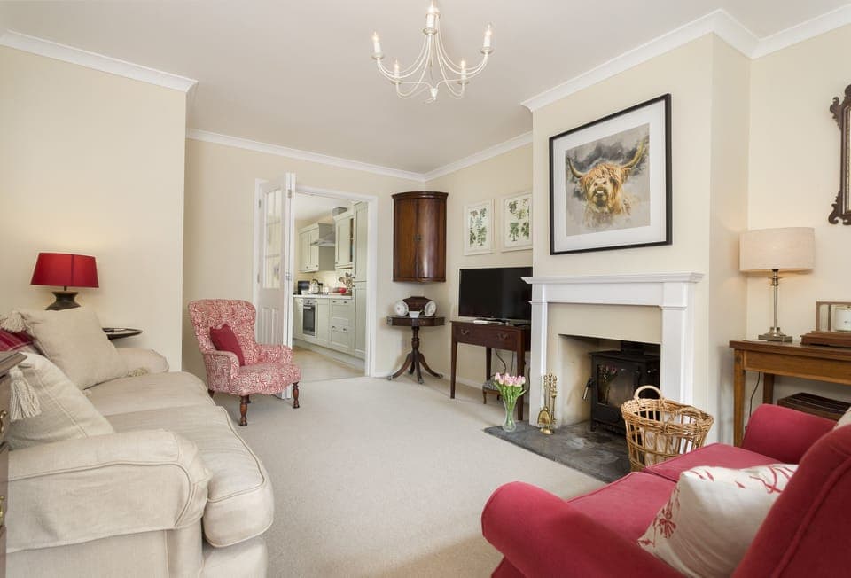 Ground floor: Cosy sitting room with wood burning stove