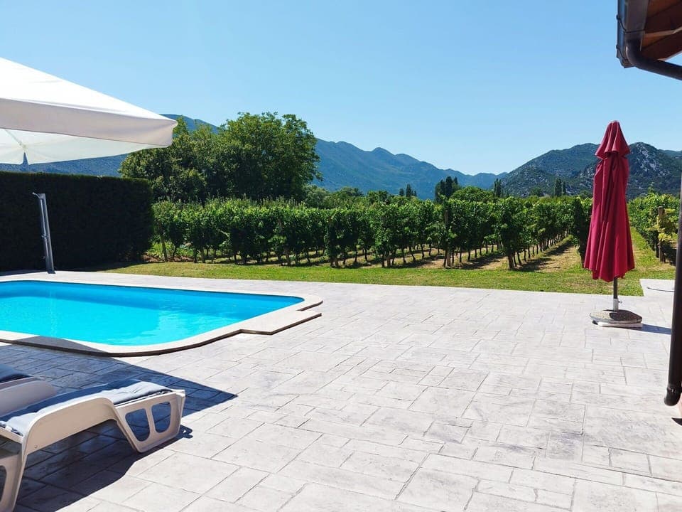 Swimming Pool, Umbrella, Outdoor Furniture, Resort, Mountain Range, Shade, Flagstone, Leisure, Tile, Eco Hotel