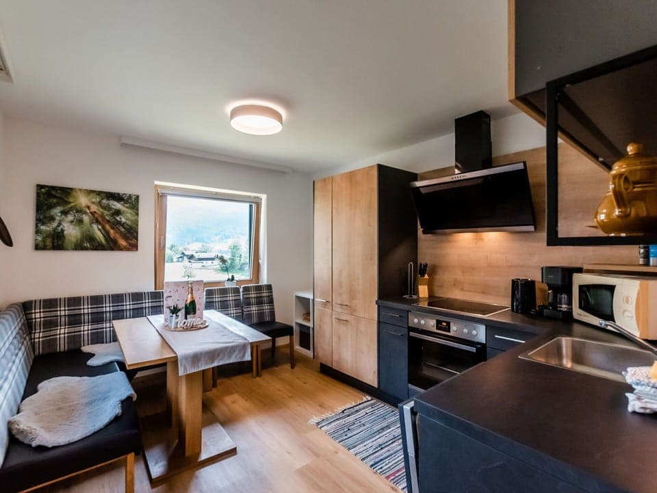 Table, Furniture, Countertop, Cabinetry, Wood, Lighting, Television, Home Appliance, Living Room, Kitchen Stove