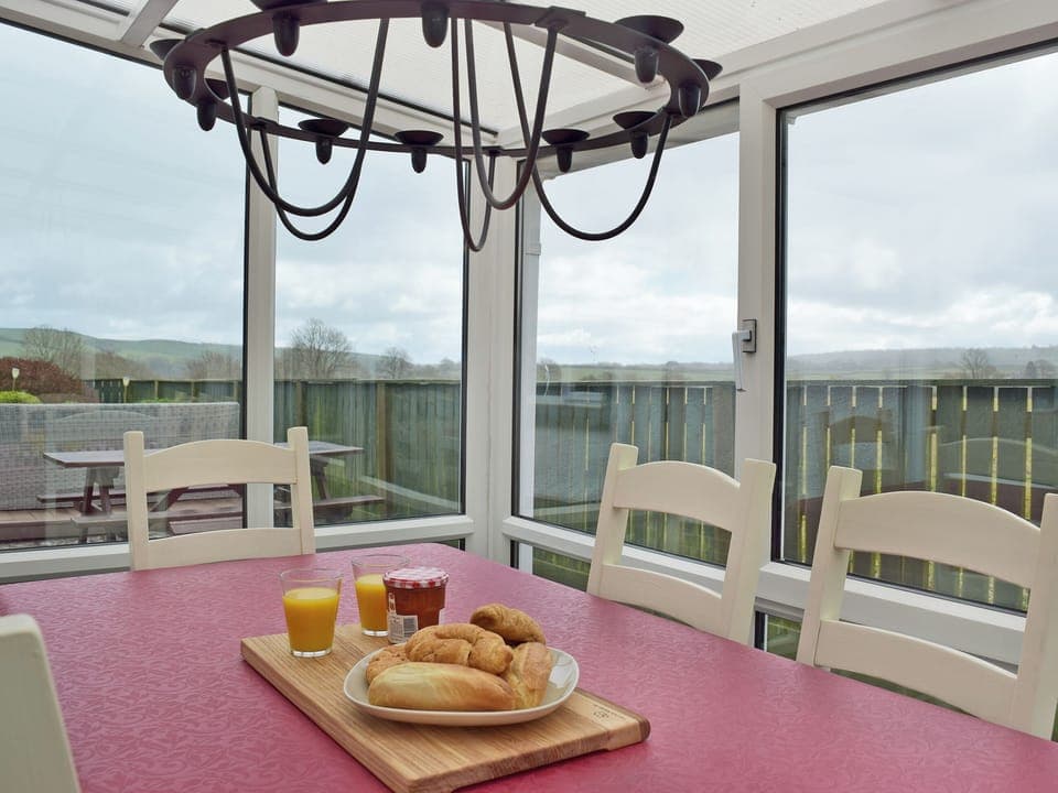 Conservatory with patio door leading to garden | Pleasant Valley, St Florence